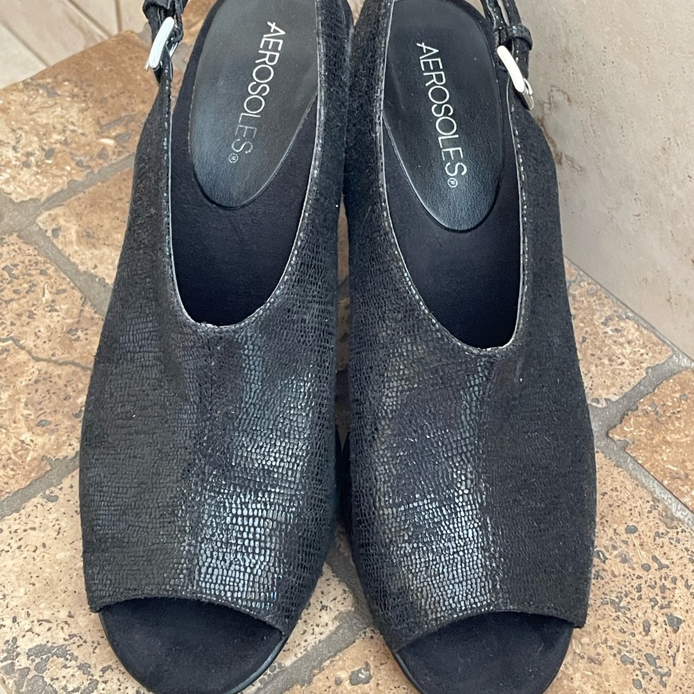 Stylish black heels.  Peek a boo toe. Size 8.5 medium